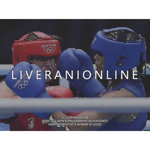 (120806) -- LONDON, Aug. 6, 2012 () -- Katie Taylor of Ireland (red) competes with Natasha Jonas of Britain during the quarterfinal match of women\'s light (60kg) Boxing event at London 2012 Olympic Games, London, Britain, Aug. 6, 2012. Katie Taylor won the match 26-15. (/Wang Shen) AG ALDO LIVERANI S A S ONLY ITALY