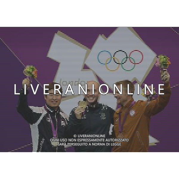 (120806) -- LONDON, Aug. 6, 2012 () -- Gold medalist Niccolo Campriani (C) of Italy, silver medalist Kim Jonghyun (L) of South Korea and bronze medalist Matthew Emmons of the United States pose at awarding ceremony of men\'s 50m rifle 3 positions of shooting at London 2012 Olympic Games, London, Britain, Aug. 6, 2012. Niccolo Campriani of Italy won gold medal and set a new Olympic record with 1278.5 in this event. (/Wang Lili)(zgp) AG ALDO LIVERANI S A S ONLY ITALY