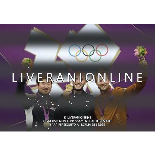 (120806) -- LONDON, Aug. 6, 2012 () -- Gold medalist Niccolo Campriani (C) of Italy, silver medalist Kim Jonghyun (L) of South Korea and bronze medalist Matthew Emmons of the United States pose at awarding ceremony of men\'s 50m rifle 3 positions of shooting at London 2012 Olympic Games, London, Britain, Aug. 6, 2012. Niccolo Campriani of Italy won gold medal and set a new Olympic record with 1278.5 in this event. (/Zeng Yi)(zgp) AG ALDO LIVERANI S A S ONLY ITALY