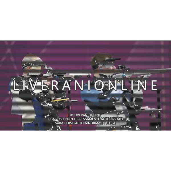 (120806) -- LONDON, Aug. 6, 2012 () -- Niccolo Campriani (L) of Italy competes during men\'s 50m rifle 3 positions final of shooting at London 2012 Olympic Games, London, Britain, Aug. 6, 2012. Niccolo Campriani of Italy won gold medal and set a new Olympic record with 1278.5 in this event. (/Wang Lili)(zgp) AG ALDO LIVERANI S A S ONLY ITALY