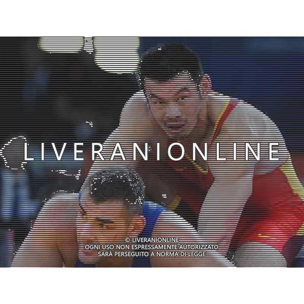 (120806) -- LONDON, Aug. 6, 2012 () -- Liu Deli of China (in red) competes with Mihaly Beak-Bardos of Hungary during men\'s wrestling greco-roman 60kg qualifications contest, at London 2012 Olympic Games in London, Britain, on August 6, 2012. Mihaly Beak-Bardos of Hungary won. (/Li Gang) (nxl) AG ALDO LIVERANI S A S ONLY ITALY