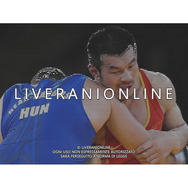 (120806) -- LONDON, Aug. 6, 2012 () -- Liu Deli of China (in red) competes with Mihaly Beak-Bardos of Hungary during men\'s wrestling greco-roman 60kg qualifications contest, at London 2012 Olympic Games in London, Britain, on August 6, 2012. Mihaly Beak-Bardos of Hungary won. (/Li Gang) (nxl) AG ALDO LIVERANI S A S ONLY ITALY