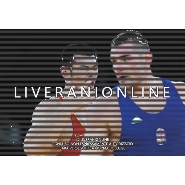 (120806) -- LONDON, Aug. 6, 2012 () -- Liu Deli of China (in red) competes with Mihaly Beak-Bardos of Hungary during men\'s wrestling greco-roman 60kg qualifications contest, at London 2012 Olympic Games in London, Britain, on August 6, 2012. Mihaly Beak-Bardos of Hungary won. (/Li Gang) (nxl) AG ALDO LIVERANI S A S ONLY ITALY