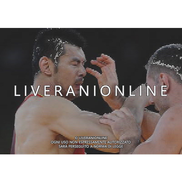(120806) -- LONDON, Aug. 6, 2012 () -- Liu Deli of China (in red) competes with Mihaly Beak-Bardos of Hungary during men\'s wrestling greco-roman 60kg qualifications contest, at London 2012 Olympic Games in London, Britain, on August 6, 2012. Mihaly Beak-Bardos of Hungary won. (/Li Gang) (nxl) AG ALDO LIVERANI S A S ONLY ITALY