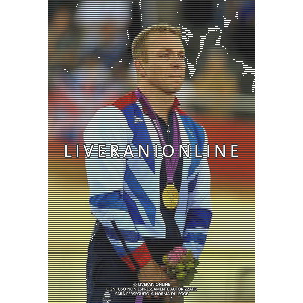 Sir Chris Hoy with tears in his eyes as he stands for the national anthem, after his won his sixth Olympic Gold medal when he crossed the line first in the Men\'s Keirin at the Olympic Velodrome in Stratford east London. Tuesday August 7, 2012. AG ALDO LIVERANI S A S ONLY ITALY