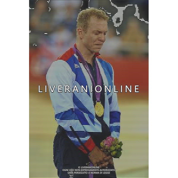 Sir Chris Hoy with tears in his eyes as he stands for the national anthem, after his won his sixth Olympic Gold medal when he crossed the line first in the Men\'s Keirin at the Olympic Velodrome in Stratford east London. Tuesday August 7, 2012. AG ALDO LIVERANI S A S ONLY ITALY