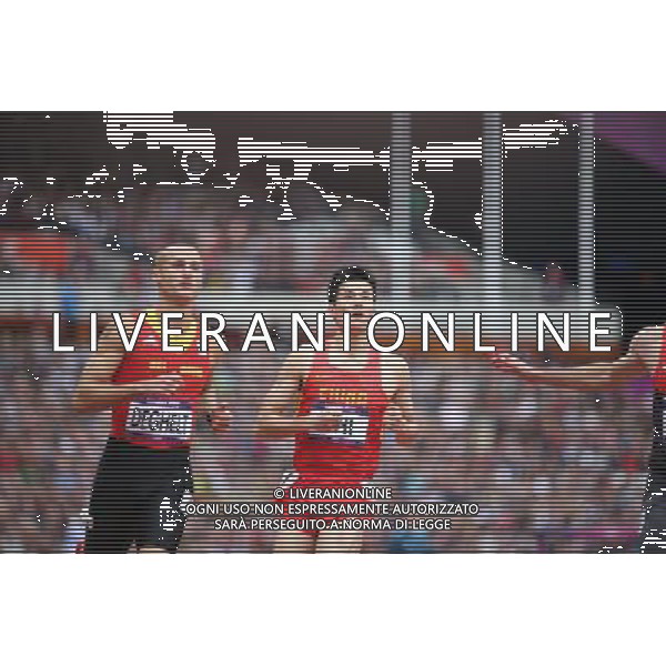 (120807) -- LONDON, Aug. 7, 2012 () -- China\'s Shi Dongpeng (R) looks at results after men\'s 110m hurdles heat at London 2012 Olympic Games, London, Britain, Aug. 7, 2012. Shi Dongpeng was disqualified for the final with 13.78. (/Liao Yujie)(zgp) AG ALDO LIVERANI S A S ONLY ITALY