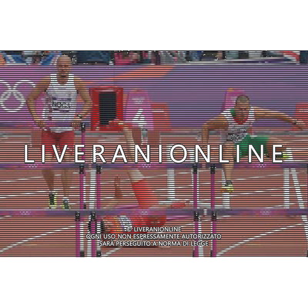 (120807) -- LONDON, Aug. 7, 2012 () -- China\'s Liu Xiang (C) falls during men\'s 110m hurdles heat at London 2012 Olympic Games, London, Britain, Aug. 7, 2012. Liu Xiang was disqualified for semifinal.(/Chen Xiaowei)(zgp) AG ALDO LIVERANI S A S ONLY ITALY