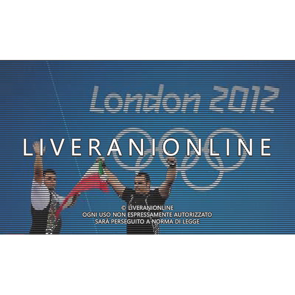 (120807) -- LONDON, Aug. 7, 2012 () -- Gold medalist Behdad Salimikordaiabi of Iran (R) and silver medalist Sajjad Anoushiravani Hamlabad of Iran attend victory ceremony of men\'s weightlifting +105kg contest, at London 2012 Olympic Games in London, Britain, on August 7, 2012. Behdad Salimikordaiabi of Iran won gold medal. (/Tao Xiyi) (nxl) AG ALDO LIVERANI S A S ONLY ITALY