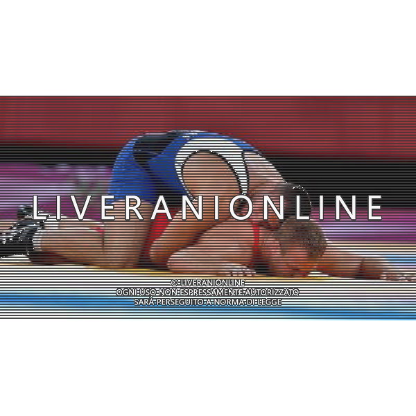 (120807) -- LONDON, Aug. 7, 2012 () -- Jimmy Lidberg of Sweden (in red) competes with Tsimafei Dzeinichenka of Belarus during men\'s wrestling Greco-Roman 96kg bronze medal contest, at London 2012 Olympic Games in London, Britain, on August 7, 2012. (/Gesang Dawa) (nxl) AG ALDO LIVERANI S A S ONLY ITALY