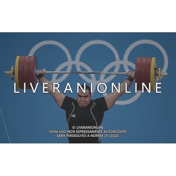 (120807) -- LONDON, Aug. 7, 2012 () -- Behdad Salimikordaiabi of Iran takes part in men\'s weightlifting +105kg contest, at London 2012 Olympic Games in London, Britain, on August 7, 2012. Behdad Salimikordaiabi of Iran won gold medal. (/Tao Xiyi) (nxl) AG ALDO LIVERANI S A S ONLY ITALY
