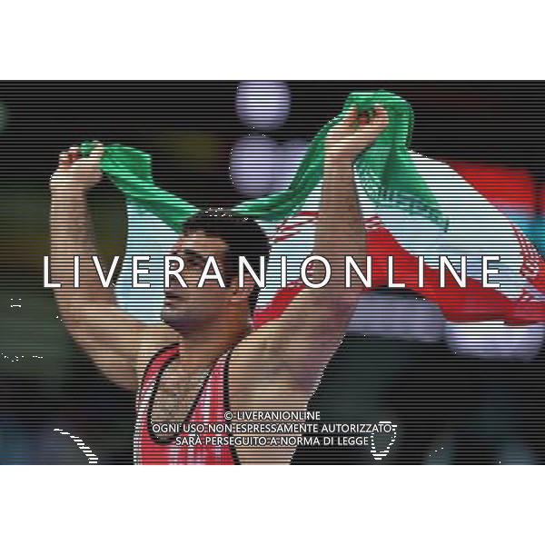 (120807) -- LONDON, Aug. 7, 2012 () -- Ghasem Gholamreza Rezaei of Iran celebrates after winning in men\'s wrestling Greco-Roman 96kg gold medal contest, at London 2012 Olympic Games in London, Britain, on August 7, 2012. (/Gesang Dawa) (nxl) AG ALDO LIVERANI S A S ONLY ITALY