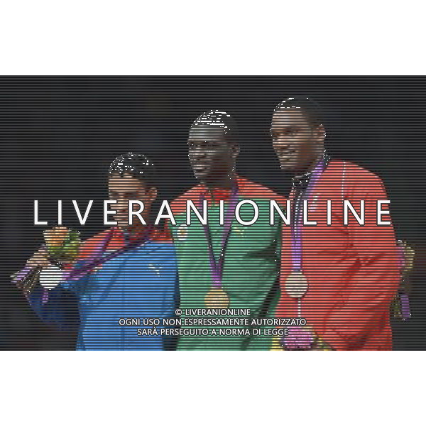 (120807) -- LONDON, Aug. 7, 2012 () -- Gold medalist Kirani James of Grenada (C), silver medalist Luguelin Santos of the Dominican Republic (L) and bronze medalist Lalonde Gordon of Trinidad \' Tobago attend victory ceremony of men\'s 400m contest, at London 2012 Olympic Games in London, Britain, on August 7, 2012. (/Yang Zongyou) (nxl) AG ALDO LIVERANI S A S ONLY ITALY