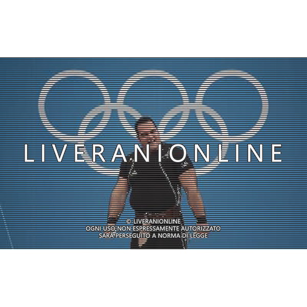 (120807) -- LONDON, Aug. 7, 2012 () -- Behdad Salimikordaiabi of Iran takes part in men\'s weightlifting +105kg contest, at London 2012 Olympic Games in London, Britain, on August 7, 2012. Behdad Salimikordaiabi of Iran won gold medal. (/Tao Xiyi) (nxl) AG ALDO LIVERANI S A S ONLY ITALY