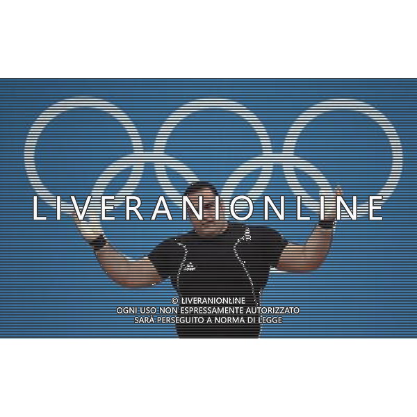 (120807) -- LONDON, Aug. 7, 2012 () -- Behdad Salimikordaiabi of Iran takes part in men\'s weightlifting +105kg contest, at London 2012 Olympic Games in London, Britain, on August 7, 2012. Behdad Salimikordaiabi of Iran won gold medal. (/Tao Xiyi) (nxl) AG ALDO LIVERANI S A S ONLY ITALY