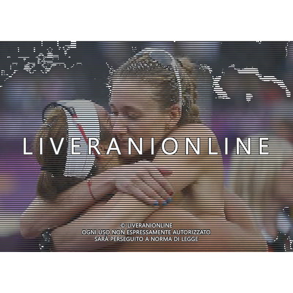 (120807) -- LONDON, Aug. 7, 2012 () -- Misty May-Treanor and Kirri Walsh Jennings of the United States celebrate after winning the women\'s beach volleyball semifinal match against China\'s Xue Chen and Zhang Xi at London 2012 Olympic Games, London, Britain, Aug. 7, 2012. (/Wang Shen) AG ALDO LIVERANI S A S ONLY ITALY