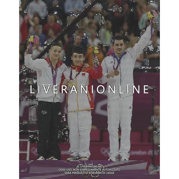 (120807) -- LONDON, Aug. 7, 2012 () -- Gold medalist Feng Zhe (C) of China, silver medalist March Nguyen (L) of Germany, bronze medalist Hamilton Sabot of France pose at awarding ceremony of men\'s parallel bars of gymnastics artistic, at London 2012 Olympic Games in London, Britain, on August 7, 2012. (/Shen Bohan) (zgp) AG ALDO LIVERANI S A S ONLY ITALY