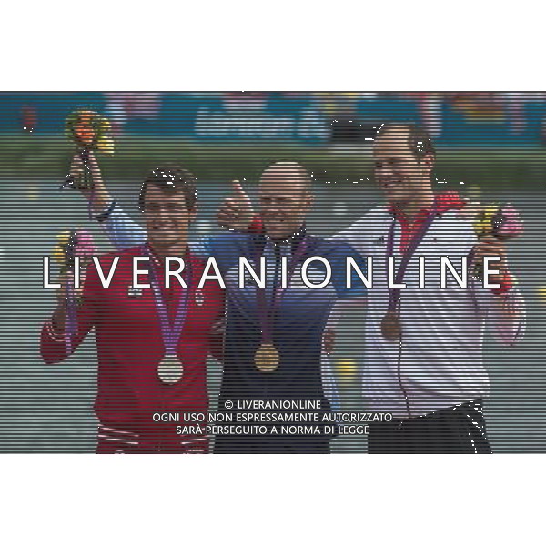 (120807) -- LONDON, Aug. 7, 2012 () -- Gold medalist Eirik Veras Larsen of Norway (C), silver medalist Adam van Koeverden of Canada (L) and bronze medalist Max Hoff of Germany attend victory ceremony of men\'s kayak single (K1) 1000m competition, at London 2012 Olympic Games in Britain, on August 7, 2012. (/Cheng Min) (nxl) AG ALDO LIVERANI S A S ONLY ITALY