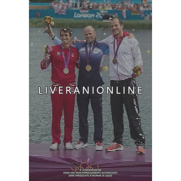 (120807) -- LONDON, Aug. 7, 2012 () -- Gold medalist Eirik Veras Larsen of Norway (C), silver medalist Adam van Koeverden of Canada (L) and bronze medalist Max Hoff of Germany attend victory ceremony of men\'s kayak single (K1) 1000m competition, at London 2012 Olympic Games in Britain, on August 7, 2012. (/Cheng Min) (nxl) AG ALDO LIVERANI S A S ONLY ITALY