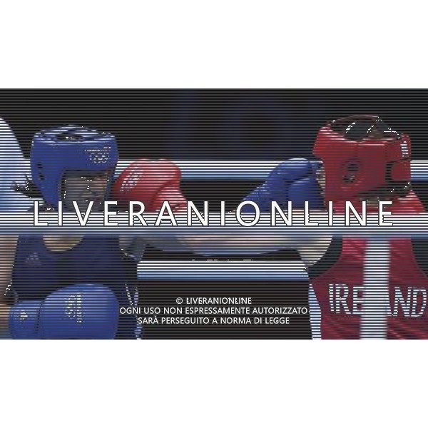 (120808) -- LONDON, Aug. 8, 2012 () -- Katie Taylor of Ireland (in red) competes with Mavzuna Chorieva of Tajikstan during women\'s boxing light (57-60kg) semifinal match, at London 2012 Olympic Games in London, Britain, on August 8, 2012. Katie Taylor of Ireland won. (/Wang Shen) (nxl) /PHOTOSHOT/AG ALDO LIVERANI SAS ITALY ONLY -