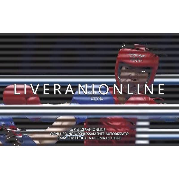 (120808) -- LONDON, Aug. 8, 2012 () -- Ren Cancan of China (in red) fights with Marien Esparza of USA during women\'s boxing Fly (48-51kg) semifinal match, at London 2012 Olympic Games in London, Britain, on August 8, 2012. Ren Cancan of China won. (/Wang Shen) (nxl) /PHOTOSHOT/AG ALDO LIVERANI SAS ITALY ONLY -