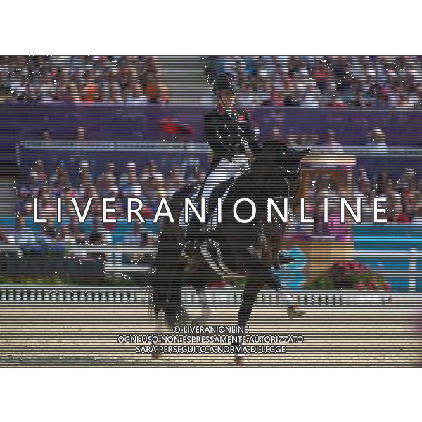 (120809) -- LONDON, Aug. 9, 2012 () -- Charlotte Dujardin of Britain takes part in Dressage Individual Grand Prix Freestyle competition of Equestrian event, at London 2012 Olympic Games in London, Britain, on August 9, 2012. Charlotte Dujardin of Britain won gold medal. (/Jin Liwang) (nxl) ©photoshot/AGENZIA ALDO LIVERANI SAS - ITALY ONLY - GIOCHI OLIMPICI, OLIMPIADI LONDRA 2012