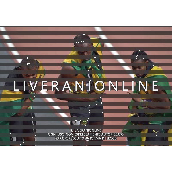 (120809) -- LONDON, Aug. 9, 2012 () -- Usain Bolt (C) of Jamaica celebrates with teammates Yohan Blake (R) and Warren Weir after men\'s 200m final, at London 2012 Olympic Games, London, Britain, Aug. 9, 2012. Jamaican athletes Usain Bolt, Yohan Blake and Warren Weir won gold, silver and bronze medals in this event. (/Gong Lei)(zgp) ©photoshot/AGENZIA ALDO LIVERANI SAS - ITALY ONLY - GIOCHI OLIMPICI, OLIMPIADI LONDRA 2012