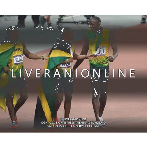(120809) -- LONDON, Aug. 9, 2012 () -- Usain Bolt (R) of Jamaica celebrates with teammates Yohan Blake (L) and Warren Weir after men\'s 200m final, at London 2012 Olympic Games, London, Britain, Aug. 9, 2012. Jamaican athletes Usain Bolt, Yohan Blake and Warren Weir won gold, silver and bronze medals in this event. (/Gong Lei)(zgp) ©photoshot/AGENZIA ALDO LIVERANI SAS - ITALY ONLY - GIOCHI OLIMPICI, OLIMPIADI LONDRA 2012
