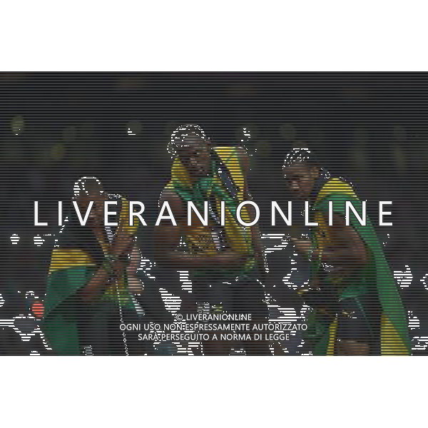 (120809) -- LONDON, Aug. 9, 2012 () -- Usain Bolt (C) of Jamaica celebrates with teammates Yohan Blake (R) and Warren Weir after men\'s 200m final, at London 2012 Olympic Games, London, Britain, Aug. 9, 2012. Jamaican athletes Usain Bolt, Yohan Blake and Warren Weir won gold, silver and bronze medals in this event. (/Li Ga)(zgp) ©photoshot/AGENZIA ALDO LIVERANI SAS - ITALY ONLY - GIOCHI OLIMPICI, OLIMPIADI LONDRA 2012