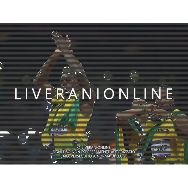 (120809) -- LONDON, Aug. 9, 2012 () -- Usain Bolt (L) of Jamaica celebrates with teammates Yohan Blake (R) and Warren Weir after men\'s 200m final, at London 2012 Olympic Games, London, Britain, Aug. 9, 2012. Jamaican athletes Usain Bolt, Yohan Blake and Warren Weir won gold, silver and bronze medals in this event. (/Li Ga)(zgp) ©photoshot/AGENZIA ALDO LIVERANI SAS - ITALY ONLY - GIOCHI OLIMPICI, OLIMPIADI LONDRA 2012