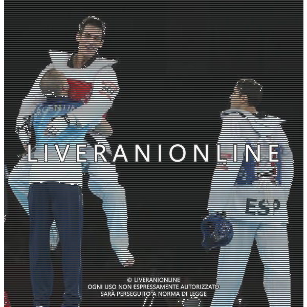 (120810) -- LONDON, Aug. 10, 2012 () -- Sebastian Eduardo Crismanich of Argentina (red) celebrates after winning over Nicolas Garcia Hemme of Spain during the gold medal match of men\'s Taekwondo -80kg event at London 2012 Olympic Games in London, Britain, on August 10, 2012. Sebastian Eduardo Crismanich of Argentina won the match and claimed the gold medal of the event. (/Wang Lili) AG ALDO LIVERANI S A S ONLY ITALY