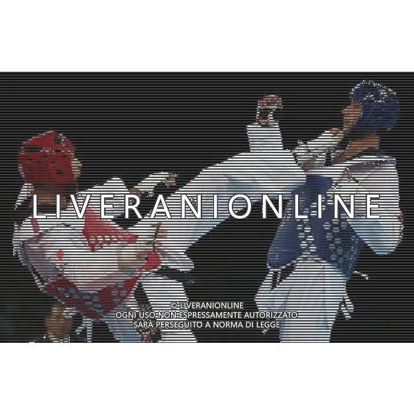 (120810) -- LONDON, Aug. 10, 2012 () -- Mauro Sarmiento of Italy (red) competes with Nesar Ahmad Bahawi of Afghanistan during the bronze medal match of men\'s Taekwondo -80kg event at London 2012 Olympic Games in London, Britain, on August 10, 2012. Mauro Sarmiento of Italy won the match and claimed the bronze medal of the event. (/Wang Lili) AG ALDO LIVERANI S A S ONLY ITALY