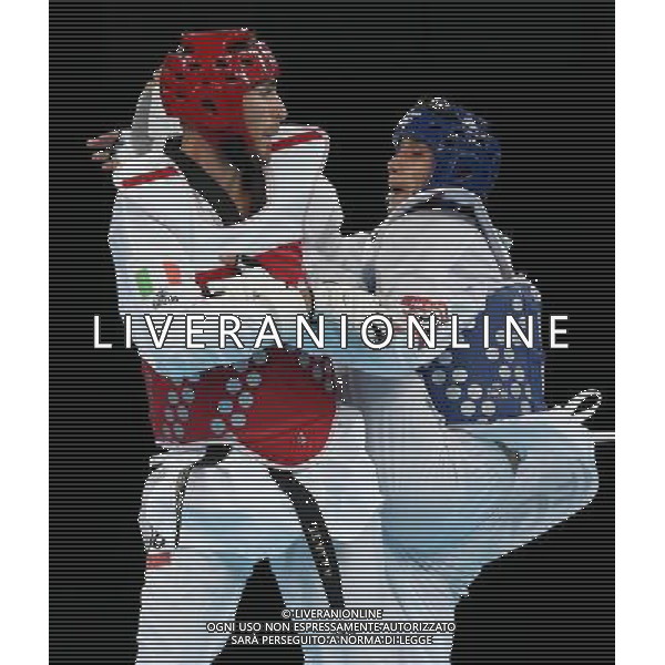 (120810) -- LONDON, Aug. 10, 2012 () -- Mauro Sarmiento of Italy (red) competes with Nesar Ahmad Bahawi of Afghanistan during the bronze medal match of men\'s Taekwondo -80kg event at London 2012 Olympic Games in London, Britain, on August 10, 2012. Mauro Sarmiento of Italy won the match and claimed the bronze medal of the event. (/Wang Lili) AG ALDO LIVERANI S A S ONLY ITALY
