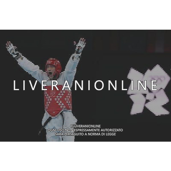 (120810) -- LONDON, Aug. 10, 2012 () -- Sebastian Eduardo Crismanich of Argentina (red) celebrates after winning over Nicolas Garcia Hemme of Spain during the gold medal match of men\'s Taekwondo -80kg event at London 2012 Olympic Games in London, Britain, on August 10, 2012. Sebastian Eduardo Crismanich of Argentina won the match and claimed the gold medal of the event. (/Wang Lili) AG ALDO LIVERANI S A S ONLY ITALY