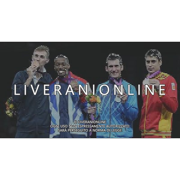 (120810) -- LONDON, Aug. 10, 2012 () -- Gold medalist Sebastian Eduardo Crismanich of Argentina (2nd R), silver medalist Nicolas Garcia Hemme of Spain (1st R), bronze medalists Lutalo Muhammad of Britain (2nd L) and Mauro Sarmiento of Italy pose at the awarding ceremony of men\'s Taekwondo -80kg event at London 2012 Olympic Games in London, Britain, on August 10, 2012. (/Wang Lili) AG ALDO LIVERANI S A S ONLY ITALY