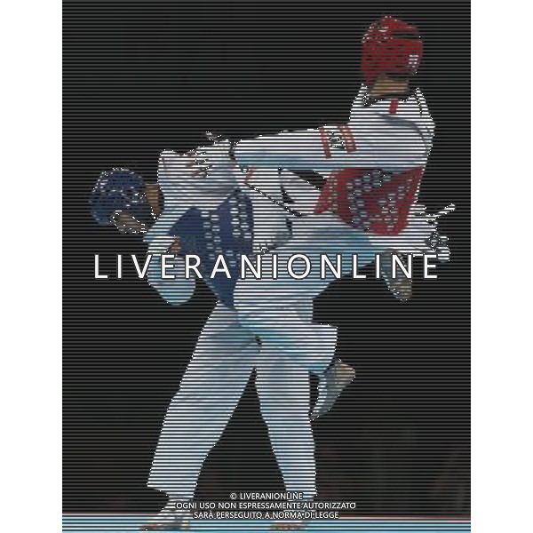 (120810) -- LONDON, Aug. 10, 2012 () -- Sebastian Eduardo Crismanich of Argentina (red) competes with Nicolas Garcia Hemme of Spain during the gold medal match of men\'s Taekwondo -80kg event at London 2012 Olympic Games in London, Britain, on August 10, 2012. Sebastian Eduardo Crismanich of Argentina won the match and claimed the gold medal of the event. (/Wang Lili) AG ALDO LIVERANI S A S ONLY ITALY