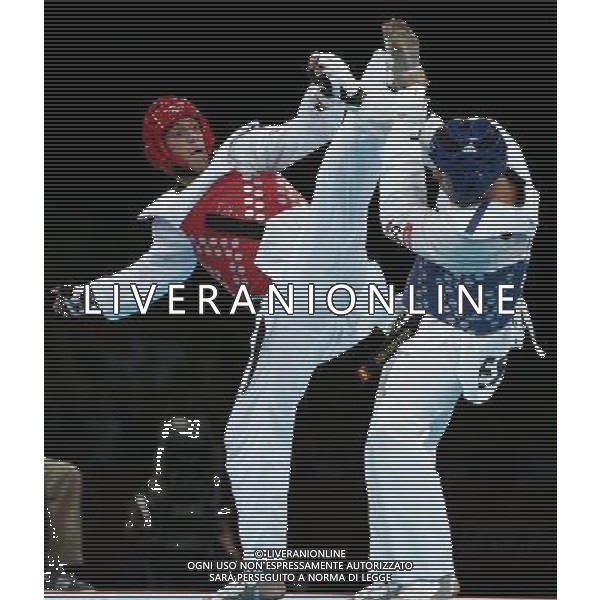 (120810) -- LONDON, Aug. 10, 2012 () -- Sebastian Eduardo Crismanich of Argentina (red) competes with Nicolas Garcia Hemme of Spain during the gold medal match of men\'s Taekwondo -80kg event at London 2012 Olympic Games in London, Britain, on August 10, 2012. Sebastian Eduardo Crismanich of Argentina won the match and claimed the gold medal of the event. (/Wang Lili) AG ALDO LIVERANI S A S ONLY ITALY