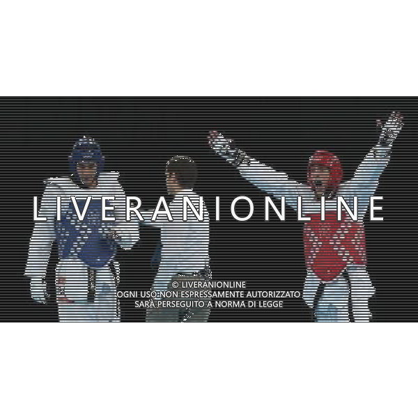 (120810) -- LONDON, Aug. 10, 2012 () -- Sebastian Eduardo Crismanich of Argentina (red) celebrates after winning over Nicolas Garcia Hemme of Spain during the gold medal match of men\'s Taekwondo -80kg event at London 2012 Olympic Games in London, Britain, on August 10, 2012. Sebastian Eduardo Crismanich of Argentina won the match and claimed the gold medal of the event. (/Wang Lili) AG ALDO LIVERANI S A S ONLY ITALY