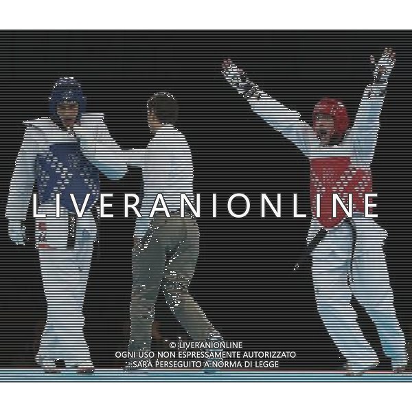 (120810) -- LONDON, Aug. 10, 2012 () -- Sebastian Eduardo Crismanich of Argentina (red) celebrates after winning over Nicolas Garcia Hemme of Spain during the gold medal match of men\'s Taekwondo -80kg event at London 2012 Olympic Games in London, Britain, on August 10, 2012. Sebastian Eduardo Crismanich of Argentina won the match and claimed the gold medal of the event. (/Wang Lili) AG ALDO LIVERANI S A S ONLY ITALY