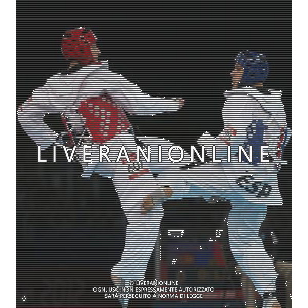 (120810) -- LONDON, Aug. 10, 2012 () -- Sebastian Eduardo Crismanich of Argentina (red) competes with Nicolas Garcia Hemme of Spain during the gold medal match of men\'s Taekwondo -80kg event at London 2012 Olympic Games in London, Britain, on August 10, 2012. Sebastian Eduardo Crismanich of Argentina won the match and claimed the gold medal of the event. (/Wang Lili) AG ALDO LIVERANI S A S ONLY ITALY