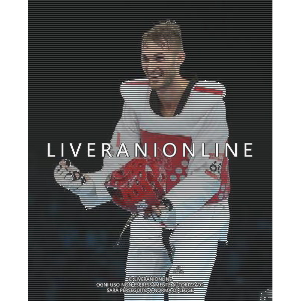 (120810) -- LONDON, Aug. 10, 2012 () -- Mauro Sarmiento of Italy celebrates after winning over Nesar Ahmad Bahawi of Afghanistan during the bronze medal match of men\'s Taekwondo -80kg event at London 2012 Olympic Games in London, Britain, on August 10, 2012. Mauro Sarmiento of Italy won the match and claimed the bronze medal of the event. (/Wang Lili) AG ALDO LIVERANI S A S ONLY ITALY