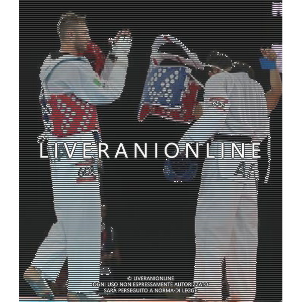 (120810) -- LONDON, Aug. 10, 2012 () -- Mauro Sarmiento of Italy (red) celebrates with his coach after winning over Nesar Ahmad Bahawi of Afghanistan during the bronze medal match of men\'s Taekwondo -80kg event at London 2012 Olympic Games in London, Britain, on August 10, 2012. Mauro Sarmiento of Italy won the match and claimed the bronze medal of the event. (/Wang Lili) AG ALDO LIVERANI S A S ONLY ITALY