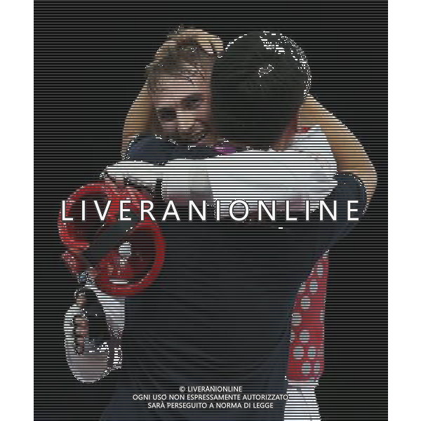 (120810) -- LONDON, Aug. 10, 2012 () -- Mauro Sarmiento of Italy (red) celebrates with his coach after winning over Nesar Ahmad Bahawi of Afghanistan during the bronze medal match of men\'s Taekwondo -80kg event at London 2012 Olympic Games in London, Britain, on August 10, 2012. Mauro Sarmiento of Italy won the match and claimed the bronze medal of the event. (/Wang Lili) AG ALDO LIVERANI S A S ONLY ITALY