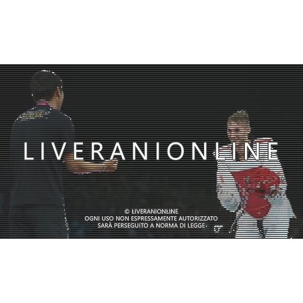 (120810) -- LONDON, Aug. 10, 2012 () -- Mauro Sarmiento of Italy (red) celebrates with his coach after winning over Nesar Ahmad Bahawi of Afghanistan during the bronze medal match of men\'s Taekwondo -80kg event at London 2012 Olympic Games in London, Britain, on August 10, 2012. Mauro Sarmiento of Italy won the match and claimed the bronze medal of the event. (/Wang Lili) AG ALDO LIVERANI S A S ONLY ITALY