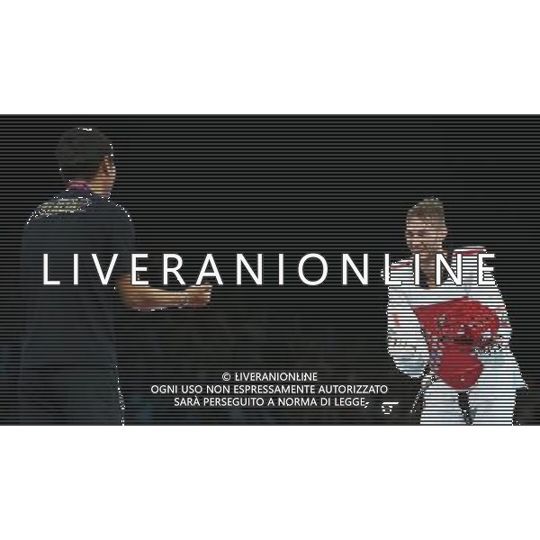 (120810) -- LONDON, Aug. 10, 2012 () -- Nesar Ahmad Bahawi of Afghanistan (red) celebrates with his coach after winning over Mauro Sarmiento of Italy during the bronze medal match of men\'s Taekwondo -80kg event at London 2012 Olympic Games in London, Britain, on August 10, 2012. Nesar Ahmad Bahawi of Afghanistan won the match and claimed the bronze medal of the event. (/Wang Lili) AG ALDO LIVERANI S A S ONLY ITALY