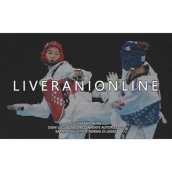 (120810) -- LONDON, Aug. 10, 2012 () -- Hwang Kyung Seon of South Korea (red) competes with Nur Tatar of Turkey during the gold medal match of women\'s Taekwondo -67kg event at London 2012 Olympic Games in London, Britain, on August 10, 2012. Hwang Kyung Seon of South Korea won the match and claimed the gold medal of the event. (/Wang Lili) AG ALDO LIVERANI S A S ONLY ITALY