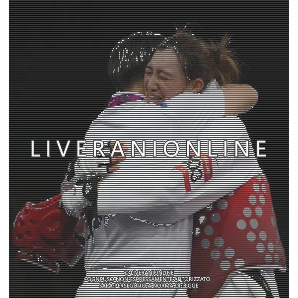 (120810) -- LONDON, Aug. 10, 2012 () -- Hwang Kyung Seon of South Korea (red) celebrates after winning over Nur Tatar of Turkey during the gold medal match of women\'s Taekwondo -67kg event at London 2012 Olympic Games in London, Britain, on August 10, 2012. Hwang Kyung Seon of South Korea won the match and claimed the gold medal of the event. (/Wang Lili) AG ALDO LIVERANI S A S ONLY ITALY