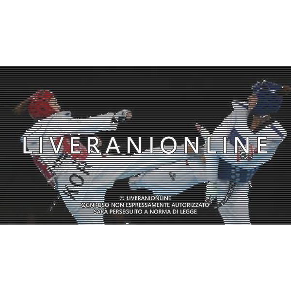 (120810) -- LONDON, Aug. 10, 2012 () -- Hwang Kyung Seon of South Korea (red) competes with Nur Tatar of Turkey during the gold medal match of women\'s Taekwondo -67kg event at London 2012 Olympic Games in London, Britain, on August 10, 2012. Hwang Kyung Seon of South Korea won the match and claimed the gold medal of the event. (/Wang Lili) AG ALDO LIVERANI S A S ONLY ITALY