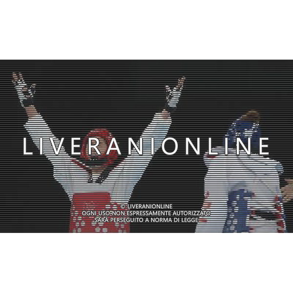 (120810) -- LONDON, Aug. 10, 2012 () -- Hwang Kyung Seon of South Korea (red) celebrates after winning over Nur Tatar of Turkey during the gold medal match of women\'s Taekwondo -67kg event at London 2012 Olympic Games in London, Britain, on August 10, 2012. Hwang Kyung Seon of South Korea won the match and claimed the gold medal of the event. (/Wang Lili) AG ALDO LIVERANI S A S ONLY ITALY