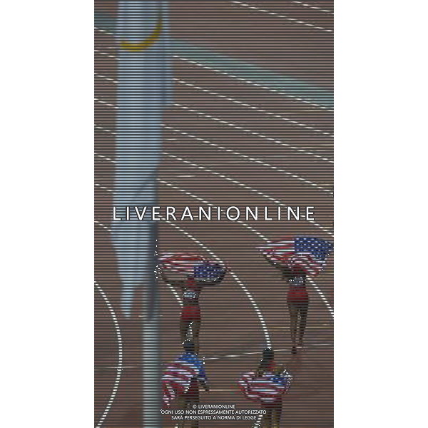 (120810) -- LONDON, Aug. 10, 2012 () -- Runners of U.S. celebrate after women\'s 4x100m relay final at London 2012 Olympic Games, London, Britain, Aug. 10, 2012. The U.S. team won gold medal in this event with a new world record of 40.82. (/Qi Heng)(zgp) AG ALDO LIVERANI S A S ONLY ITALY